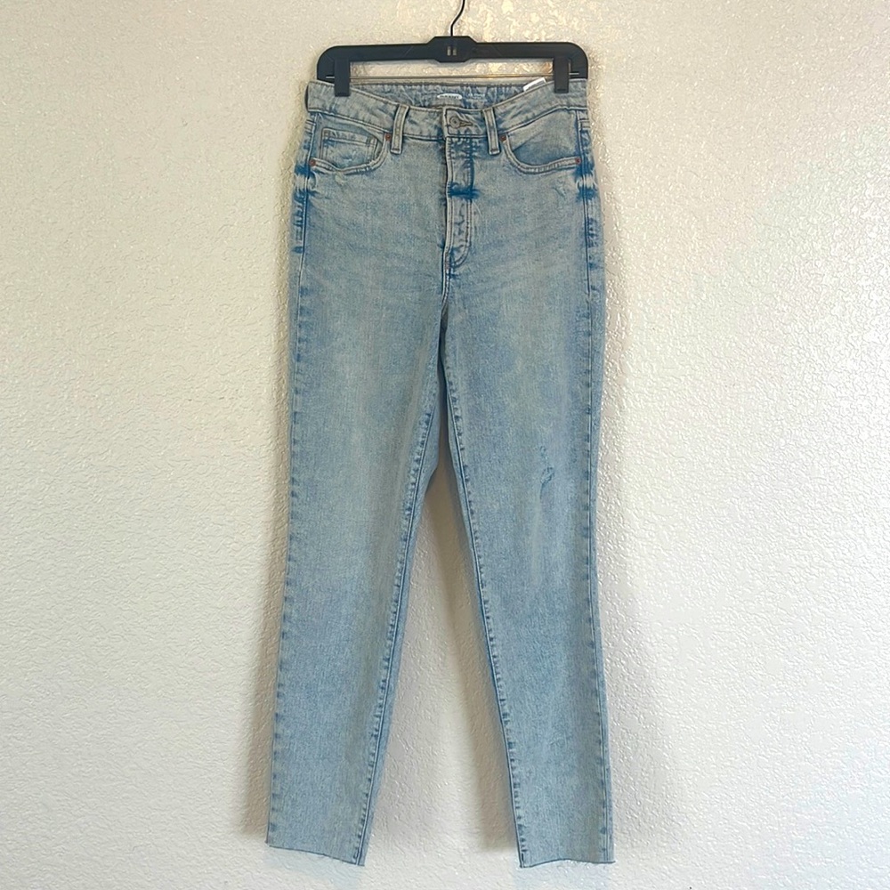 OG straight high rise jeans bleach wash. Slightly distressed raw hem.